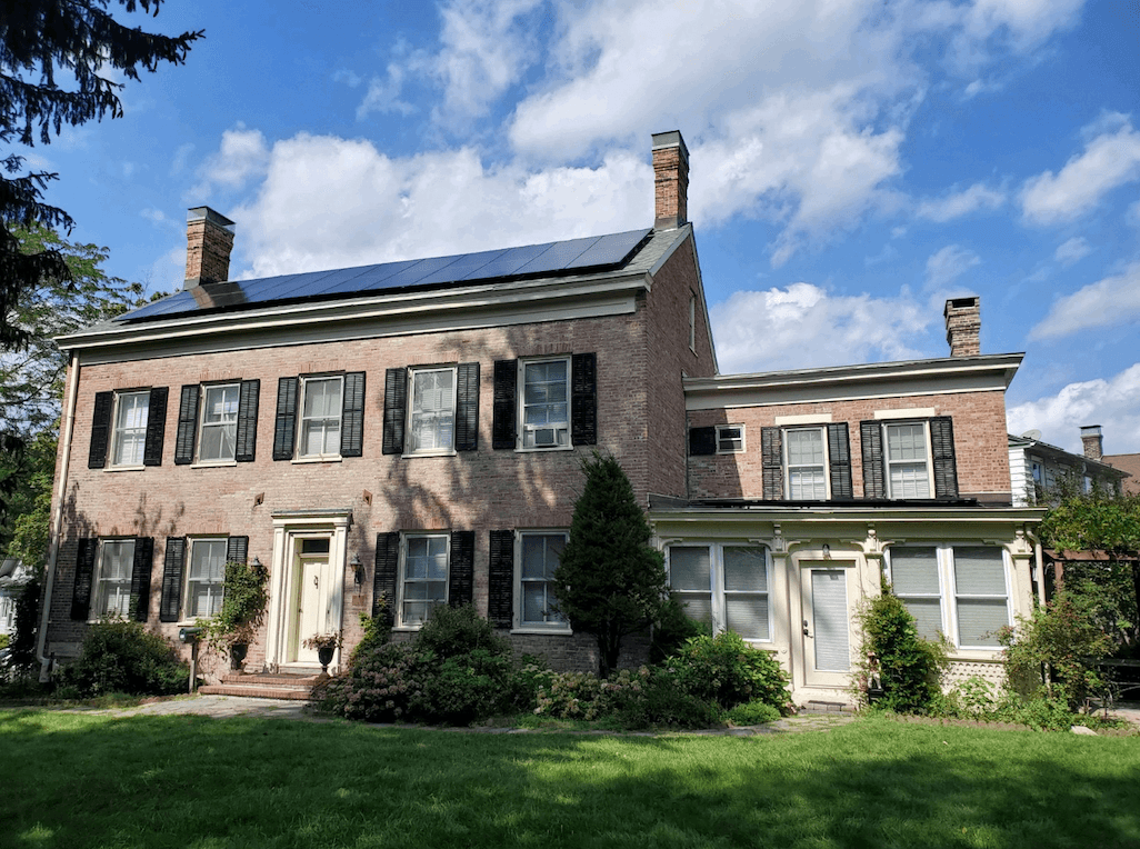 Solar panels on a white house